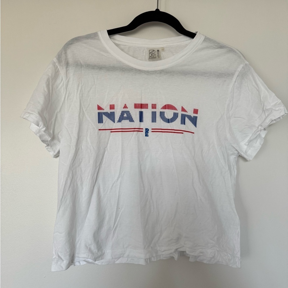 P.E Nation White Tee with Red and Blue Logo